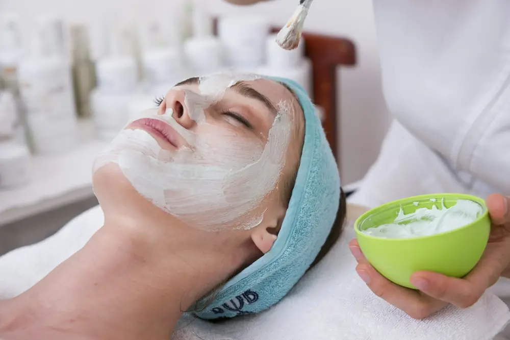 Client relaxing during a facial treatment