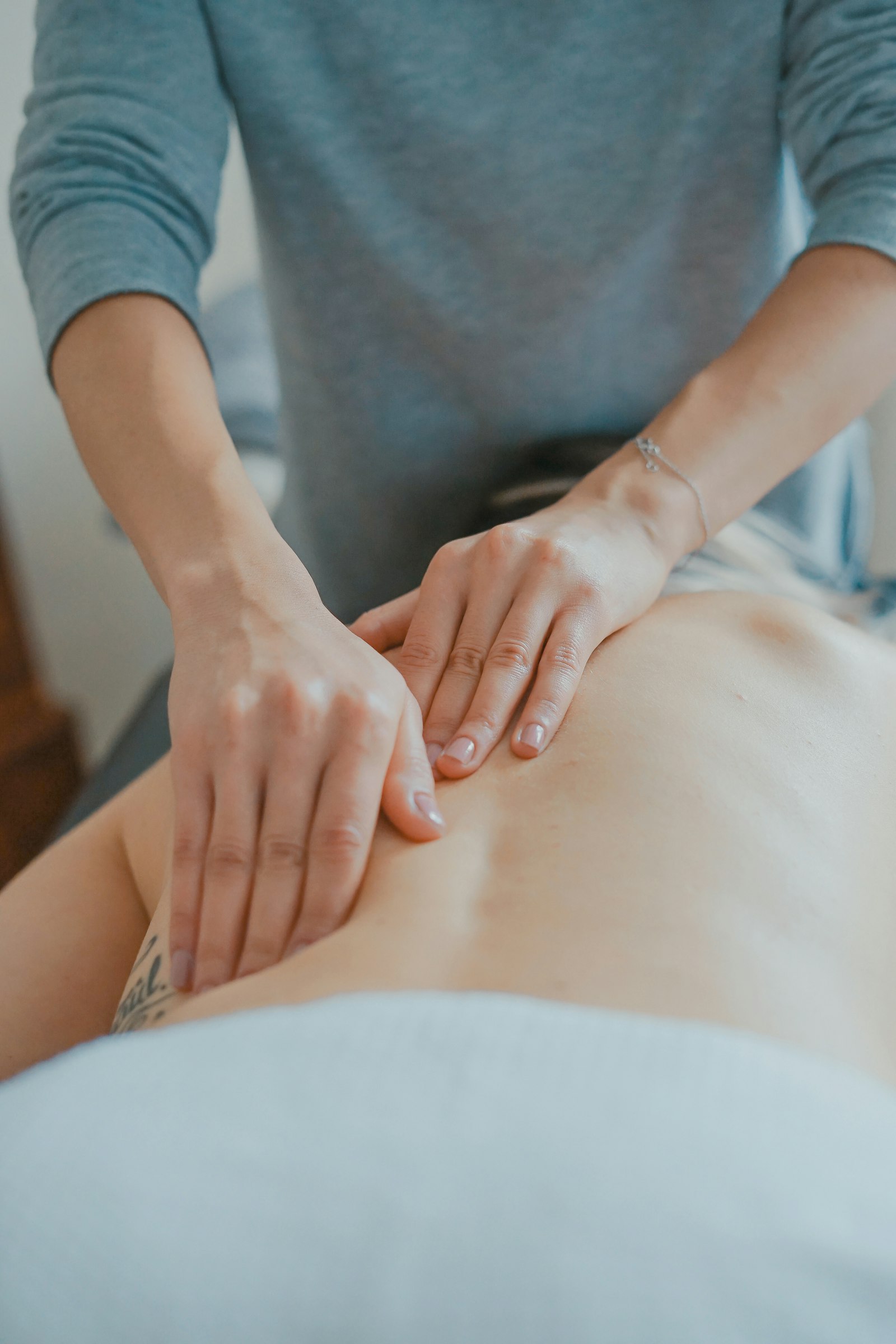 Massage therapist working on a client's back