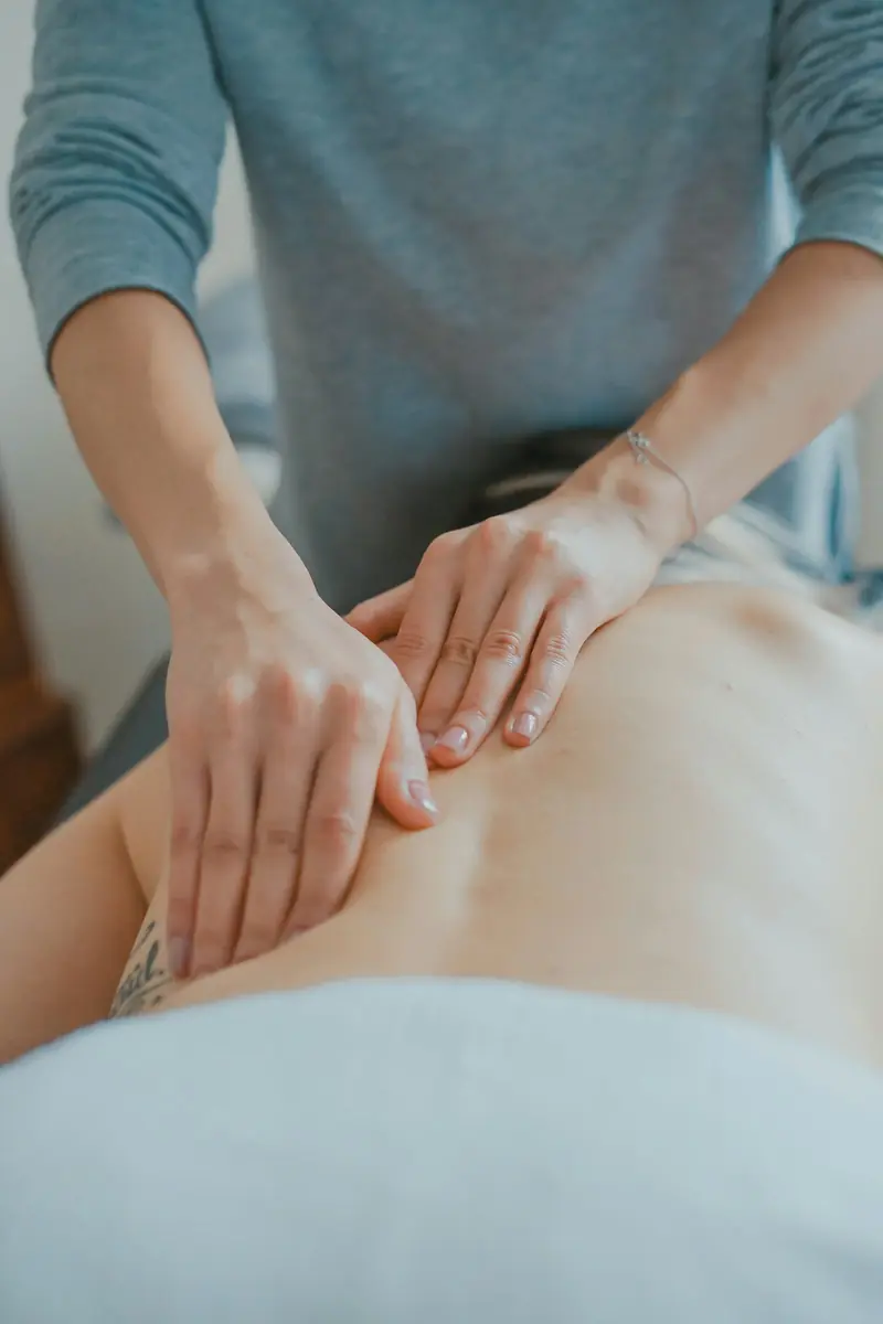 Massage therapist working on a client's back